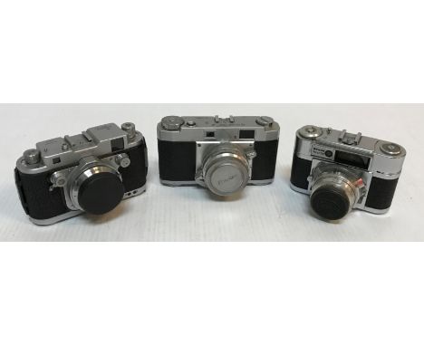 A collection of nine various German cameras including a Braun Paxette (x2), an Akarette, Praktina FX, Ricoh 35S, Robot Royal,