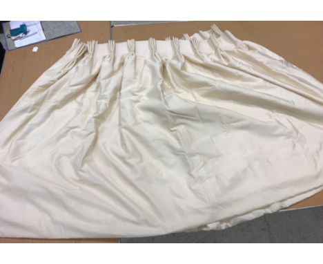 A pair of silk type cream interlined curtains with fixed triple pencil pleat headings, approx 140 cm drop x 270 wide at botto