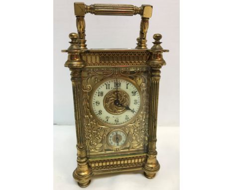 A circa 1900 French lacquered brass cased carriage clock, the dial with Arabic numerals inscribed "Vincent Weymouth" over a s