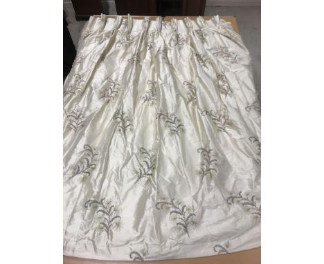 A pair of silk embroidered cream ground with foliate spray decorated interlined curtains with fixed triple pencil pleat headi