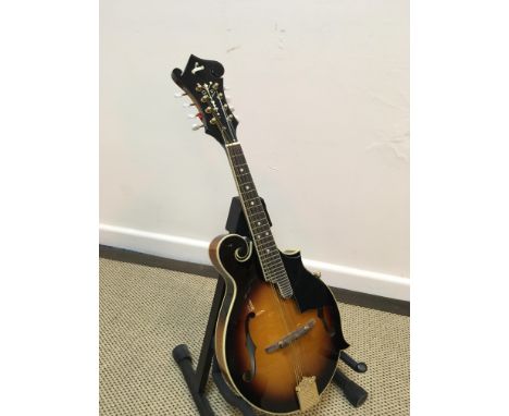 A violin bodied scroll cut away eight string mandolin with L makers mark in mother of pearl