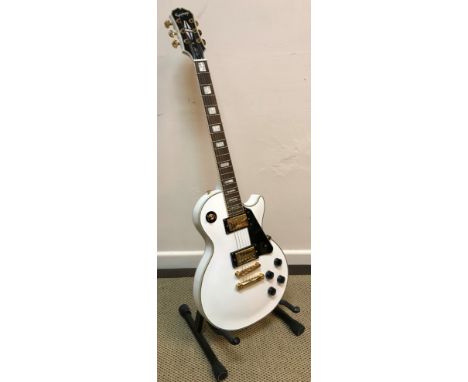 An Epiphone Les Paul custom guitar, white body together with Stagg soft case CONDITION REPORTS Has general wear and tear cond