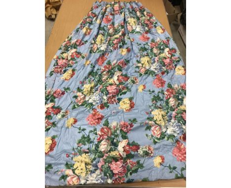 A pair of Schumacher blue ground floral bouquet decorated glazed cotton interlined curtains with fixed triple pencil pleat he