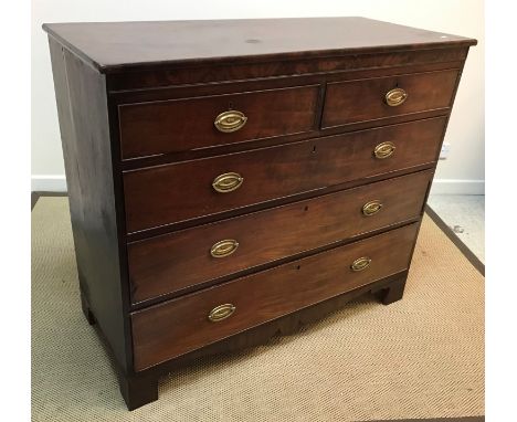 A Regency mahogany square fronted chest, the plain top above two short and three long graduated drawers and fretwork carved a