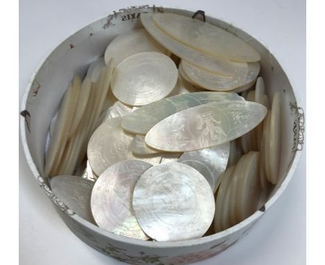 A collection of 132 mother of pearl gaming counters of circular or oval form with crown and spreadeagle carved motif