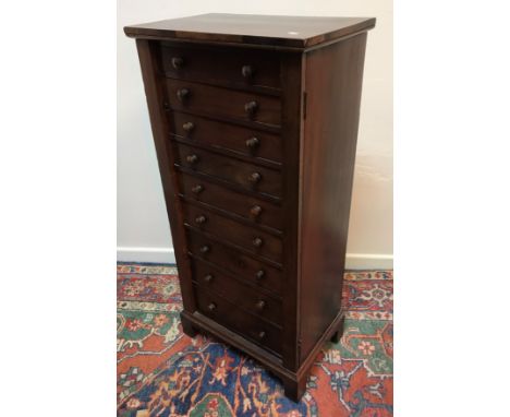 A Victorian mahogany Wellington chest, the plain top above nine drawers with turned knob handles and plain side locking mecha