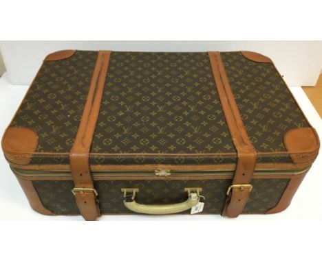 A vintage Louis Vuitton suitcase with later alterations