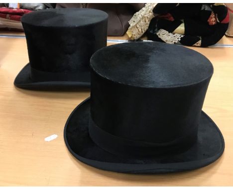 An early 20th Century Army &amp; Navy Cooperative Society leather double hat box, together with two black silk top hats, one 