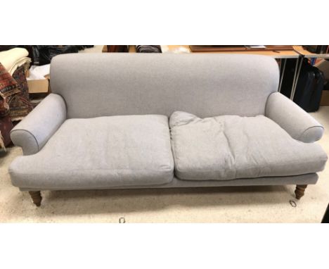 A modern pale grey upholstered scroll arm sofa on turned and stained beech front legs 228 cm wide x approx. 108 cm deep x 85 