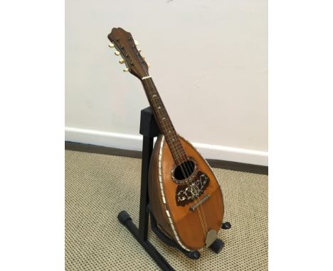 A Brambilla mandolin with ribbed silver wire strung back and tortoiseshell and mother of pearl inlaid front