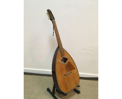 A Skylark brand guitar model MGM991 with lute shaped body, eight string