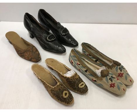 A pair of Georgian black leather shoes with buckles, a pair of early 19th Century velvet shoes with bead and wire embroidered