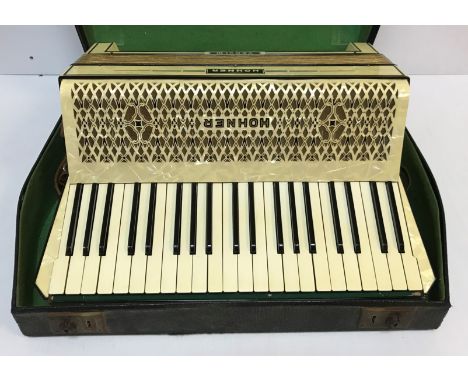 A Höhner Verdi III white faux mother of pearl cased piano accordion in hard case, 51.5 cm wide