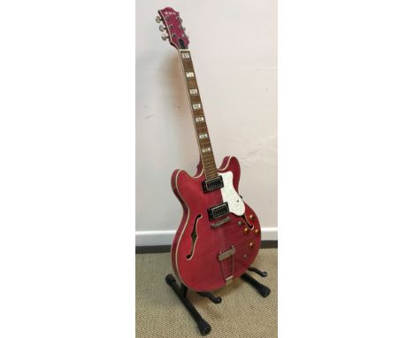 A Shine model SHM-922 SP semi acoustic guitar with cut away pink dyed body and mother of pearl finger board and mother of pea