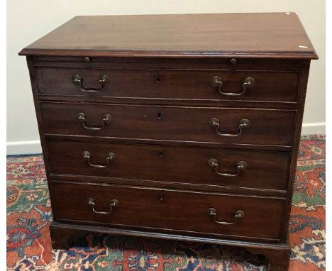 A 19th Century mahogany batchelors chest, the top with moulded edge above a brushing slide and four long graduated drawers wi