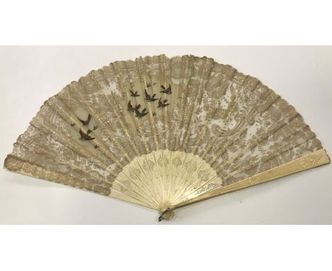 A 19th Century Cantonese ivory fan with chinoserie decoration fan depicting figures and animals and a central cartouche initi