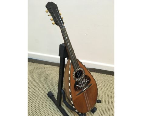 A Marco Rebora of Napoli mandolin with rosewood and satinwood strung back and mother of pearl inlaid tortoiseshell embellishe