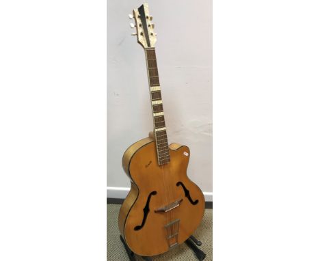 A mid-20th Century Posetti faux mother of pearl embellished violin bodied jazz guitar with simulated tortoiseshell beading