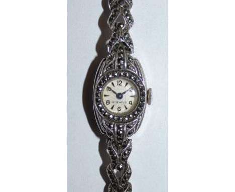 A silver and marcasite ladies manual wind wristwatch London 1960