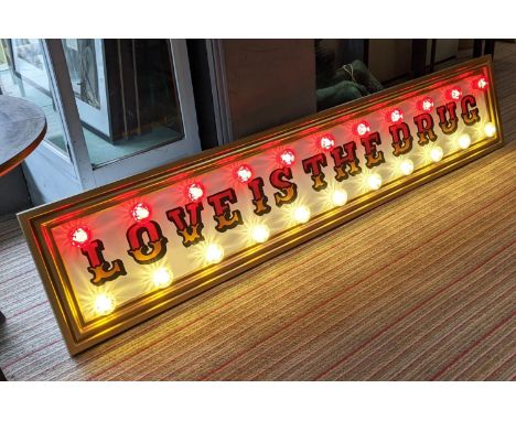 LOVE IS THE DRUG, 199.5cm x 41cm, bespoke made light up wall art by BeeRich. 