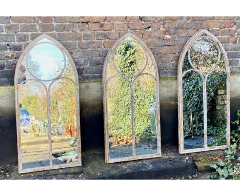 ARCHITECTURAL GARDEN MIRRORS, set of three, metal arched frames, 122cm H X 56cm W. (3) 
