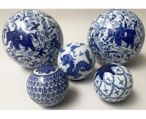 CHINESE SPHERES, ceramic blue and white two large depicting elephants and three smaller, largest 16cm W. (5) 