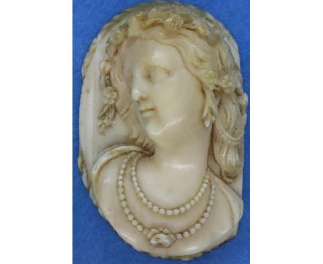 Carved ivory female portrait, unmounted, H: 7 cm. P&amp;P Group 1 (£14+VAT for the first lot and £1+VAT for subsequent lots) 