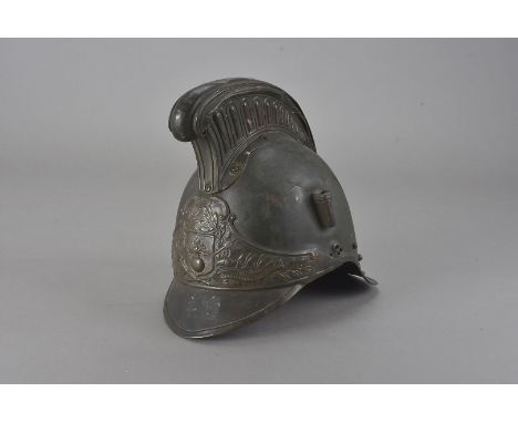 A 19th Century French fire helmet, having tall comb, with grenade and cross axe finial to the front, complete with leather li