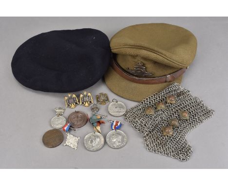 A small collection of buttons and medallions, including three by J.R Gaunt, one for the Territorial Army, a pair of chain mai