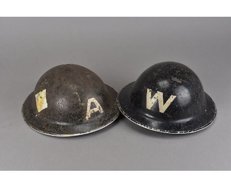 A WWII Warden's brodie helmet, marked with W's to front and rear, with a partial crest above one of the W's, by Rubery Owen &