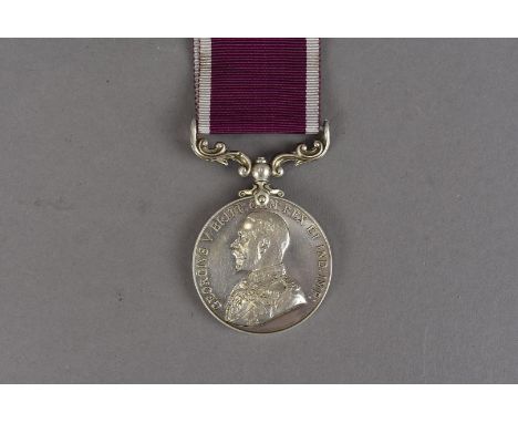 A George V Army Long Service and Good Conduct medal, with Bareheaded bust in Field Marshalls uniform, awarded to 1028624 W.O/