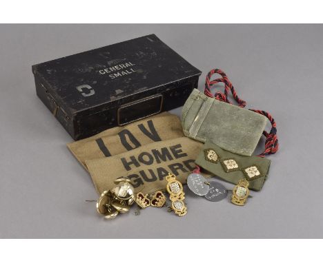 A small selection of metal and cloth badges and button, together with Home Guard and LDV armbands, a pair of dog tags, a sign