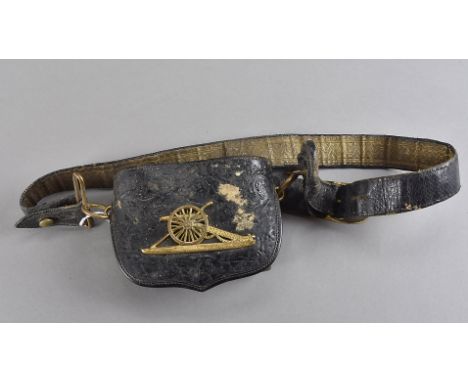 A Victorian Royal Artillery Officer's leather shoulder ammunition pouch and belt, the black hard leather pouch with fold over