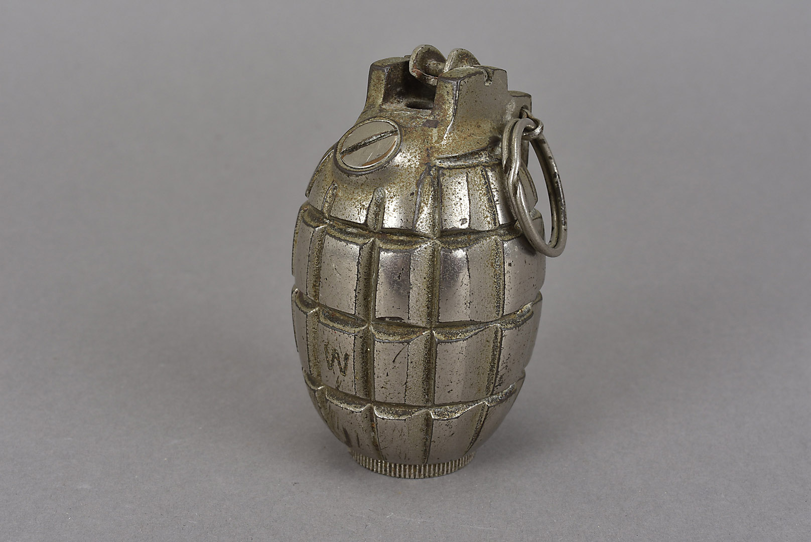 A British pineapple hand grenade, marked W to the side, Motor Equipment