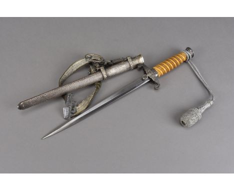 A WWII Third Reich army dagger, the blade by Puma, Solingen, with coloured ivorine handle with original sheath, blade approx 