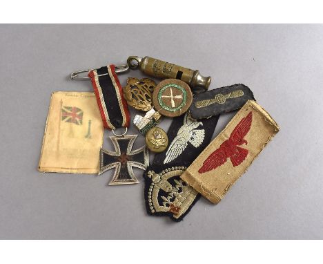 A WWII Third Reich Iron Cross, together with The Metropolitan Patent whistle by J.Hudson & Co, a pocket lighter, an RAF Cap b