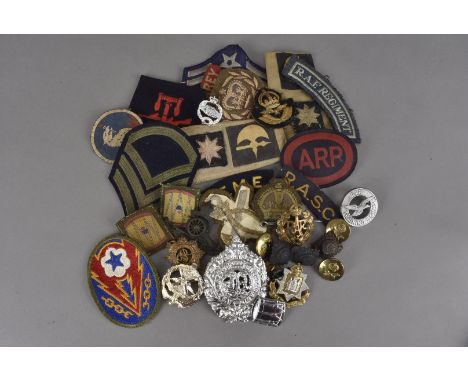 A collection of various military badges and buttons, comprising Army, Naval and RAF, including Royal Artillery, Marksman Air 