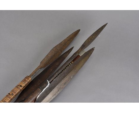 A group of four tribal spears, all with similar blades, probably all used for hunting or close combat (4)there are only three