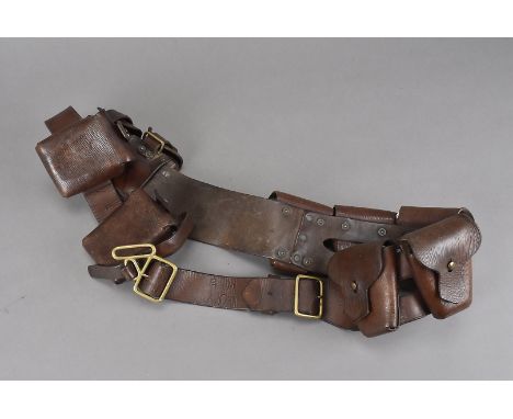 A WWI Officer's ammunition belt, dated 1906, holding nine pouches, all by T.C.Galley, and marked with broad arrows and K.C.Y 