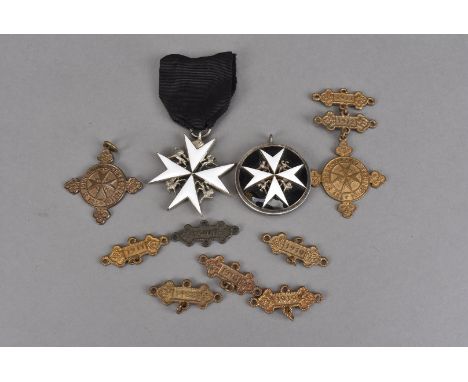 An Order of St John of Jerusalem shoulder badge, together with a type 4 enamel breast badge, plus two St John medals with num
