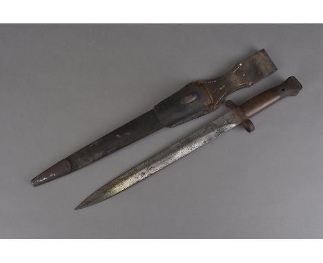 A WWII British 1888 pattern MkI bayonet, marked EFD with broad arrow to the blade, together with metal and leather scabbard w
