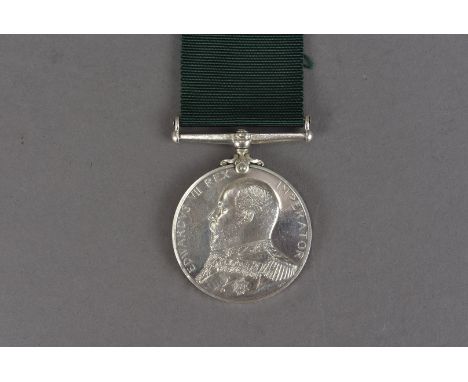 An Edward VII Royal Naval Reserve Long Service and Good Conduct medal, with bear headed bust in Admiral uniform, awarded to V