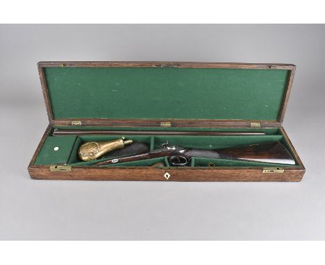 A 19th century Patrick muzzle loading double barrelled shotgun, with percussion cap action, marked 'Patrick' to the lock plat