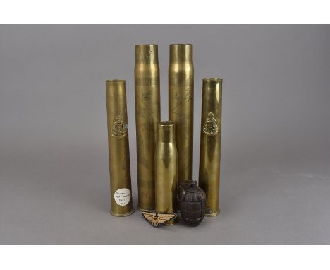 A pair of WWI engraved trench art shells, one dated 1917 and the other 1918, together with three later example, two having Ro