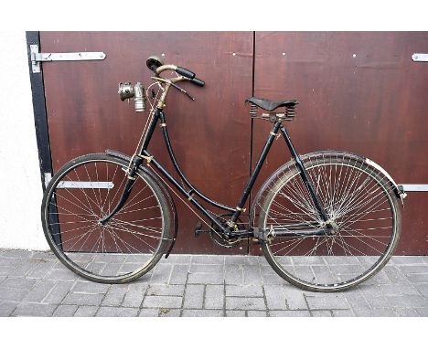 Cycling, a Edwardian ladies bicycle, 24" frame 26" wheels, black with red pinstriping,rod brakes, skirt strings to rear mudgu