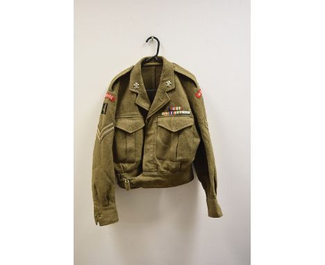 Two 1949 pattern Battledress blouses, one having Wiltshire Regiment and Sgt arm badges, plus others, the second having Royal 