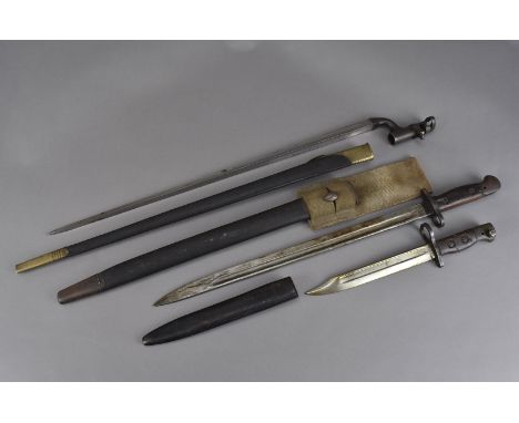 Three British military bayonets, including an Enfield 1853 Socket bayonet, a 1907 pattern bayonet by Wilkinson and a No.5 Mk1