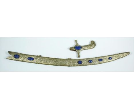 An Indian white metal foliate repousse and floral engraved sword scabbard and hilt set with Lapis Lazuli oval cabochons. L.11