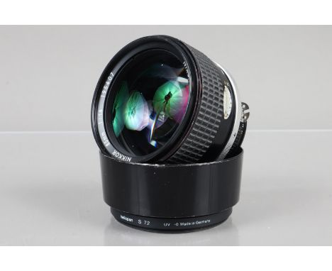 A Nikon Nikkor 85mm f/1.4 AI-S Lens, serial no 195407, barrel G, light wear, elements G-VG, light dust, with rear cap and HN-