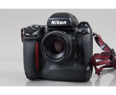 A Nikon F5 SLR Camera, serial no 3134298, powers up, shutter working, meter working, appears to function as should, body G, l